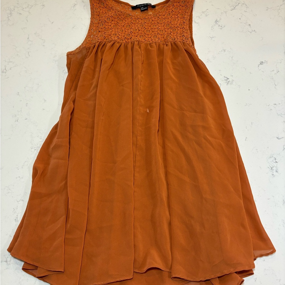 Orange long flowy tank top with lace details on shoulders